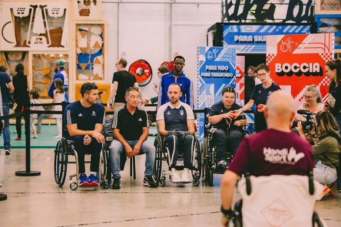 Paralympic athletes in wheelchairs try out boccia during the Paralympic Day in Paris events